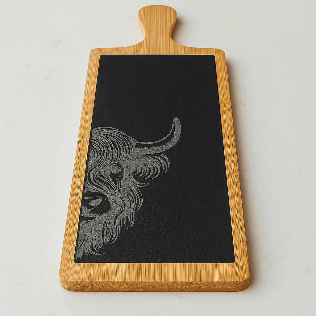 Wood and slate Charcuterie board with an engraved Highland Cow. Part of the Scottish Wildlife Collection.