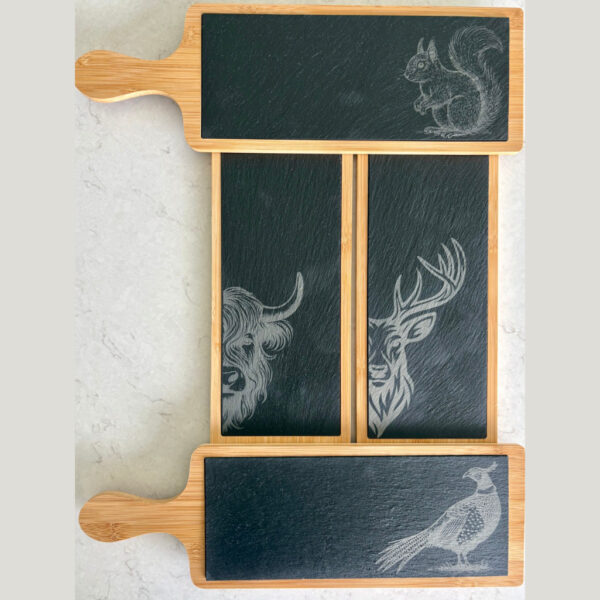 Set of 4 Scottish wildlife charcuterie boards – Stag, Highland Cow, Squirrel, Pheasant. The serving boards consist of a wooden outer and slate inner.