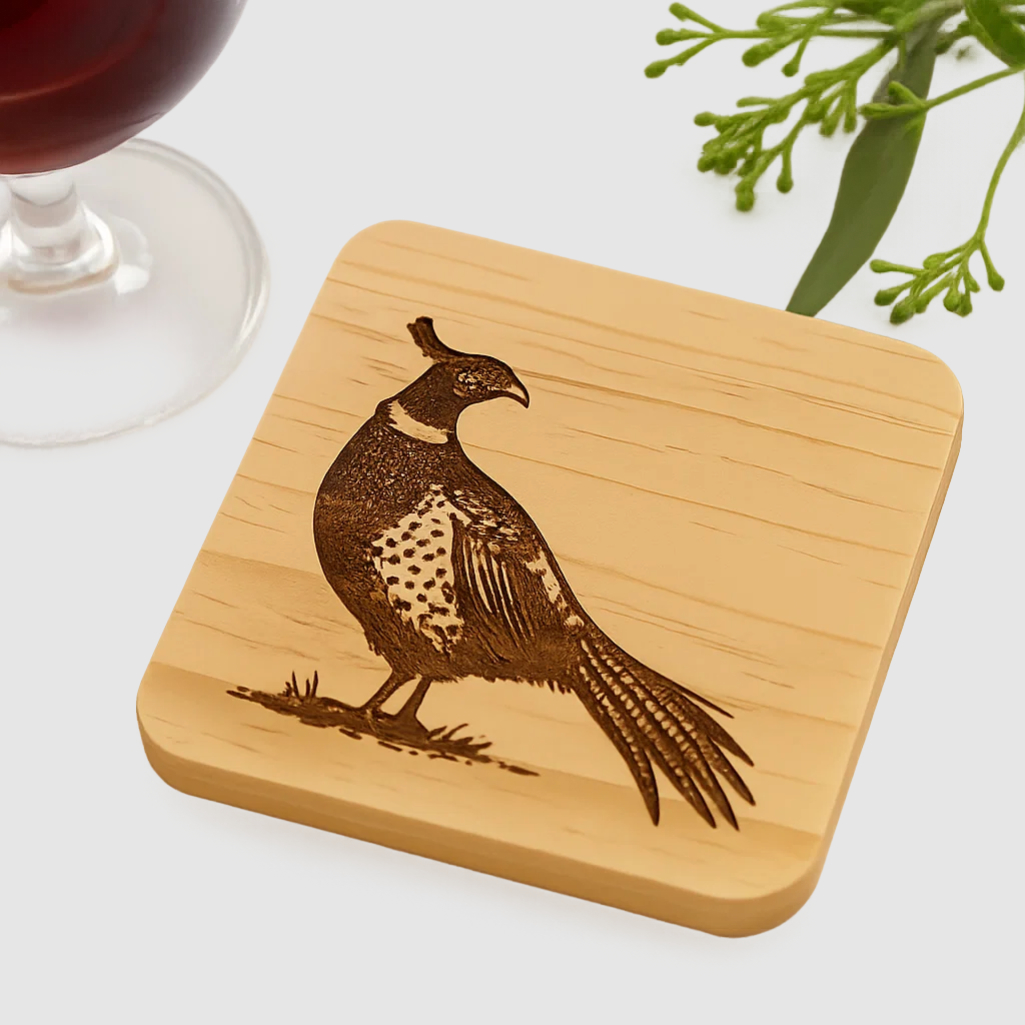 Wooden coater with a Pheasant engraved in it
