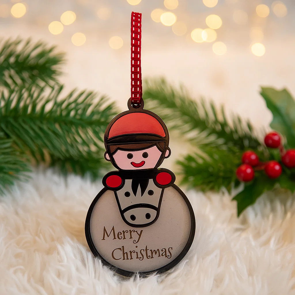 Christmas Bauble with pony and rider with the words Merry Christmas engraved on it