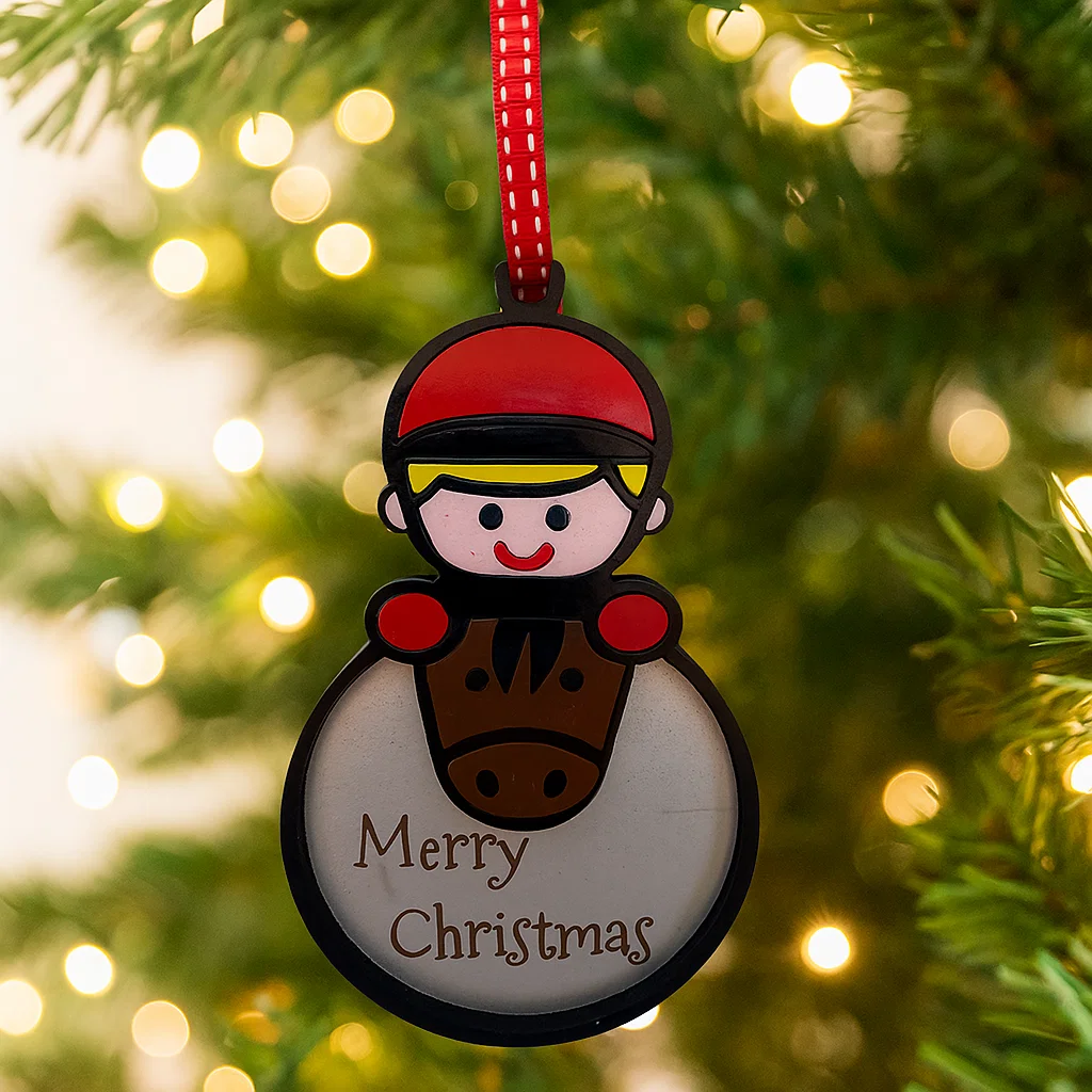 Christmas Bauble with pony and rider with the words Merry Christmas engraved on it