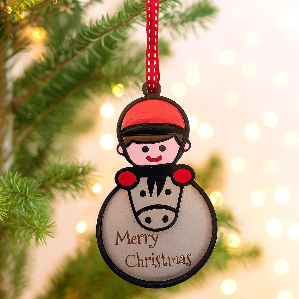 Christmas Bauble with pony and rider with the words Merry Christmas engraved on it